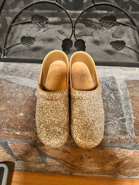 Women’s Dansko Gold Glitter Clogs